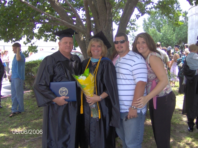 Linda Brock Gooch with husband Gary, son Brian and daughter Angela.  UWF Graduation 5/2006